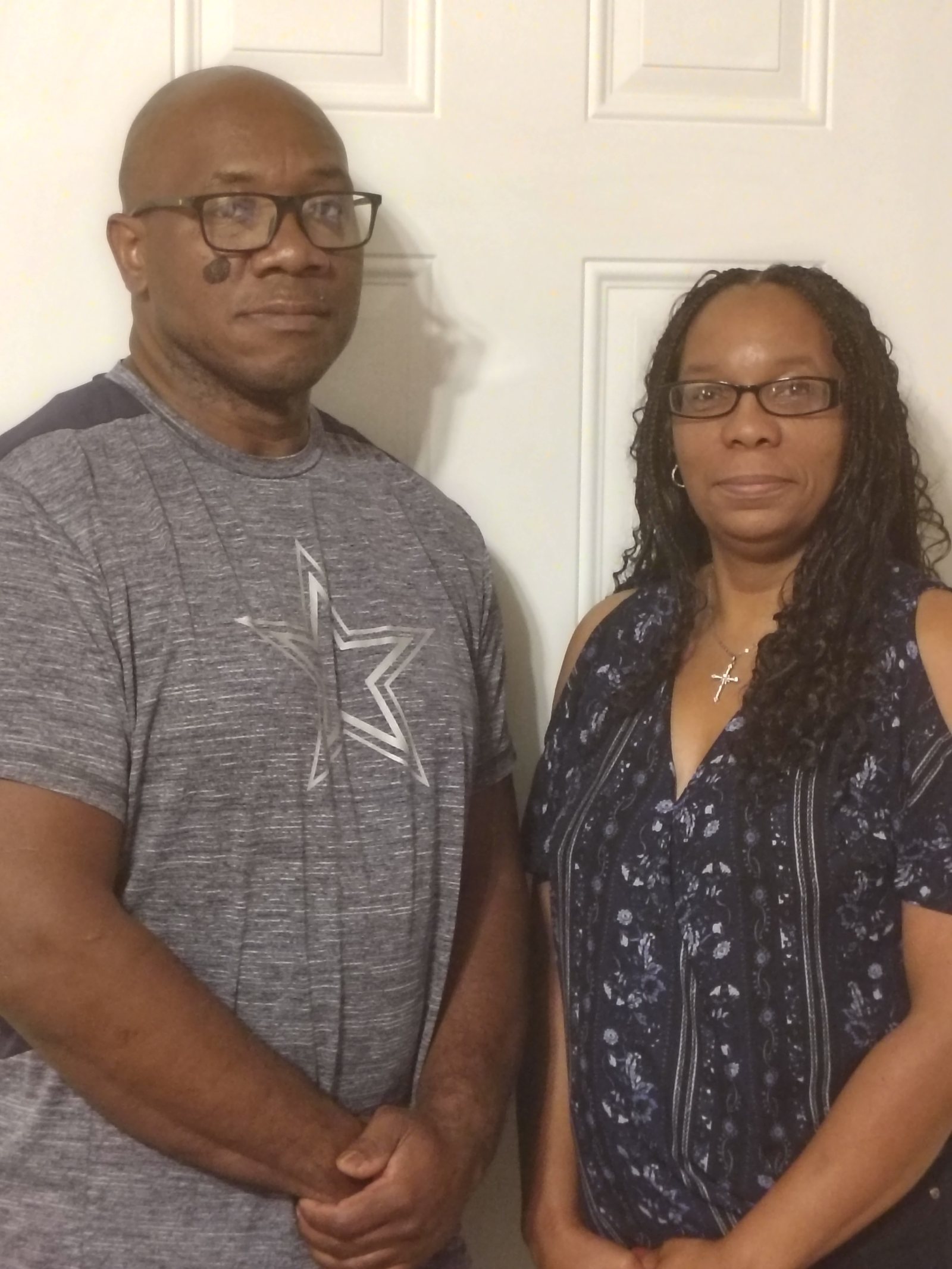 Lee and Joyce standing together indoors, casual and off the clock — the supplied portrait used exactly as shot, straightened
